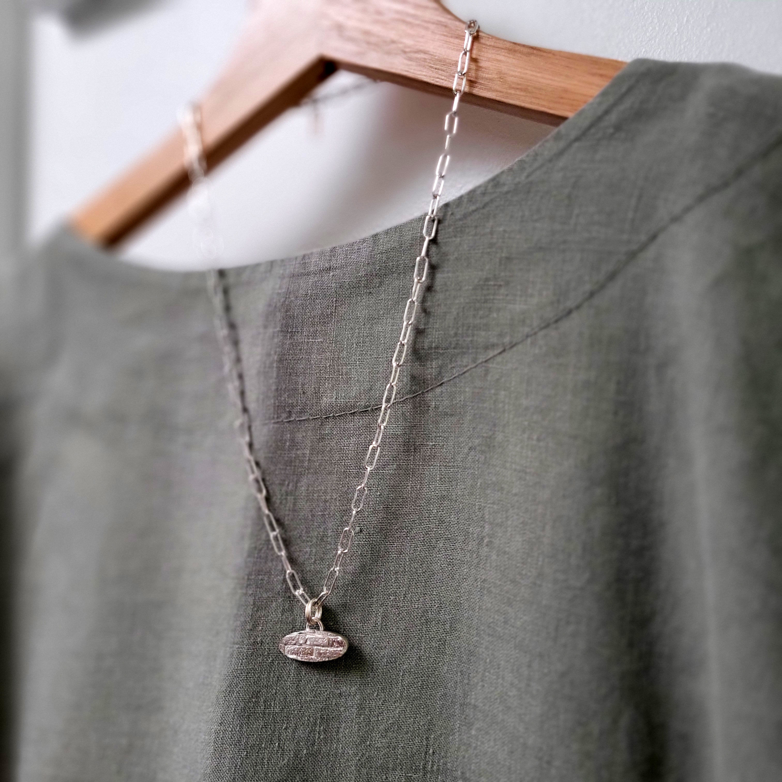 Solid silver oval pendant handmade uk