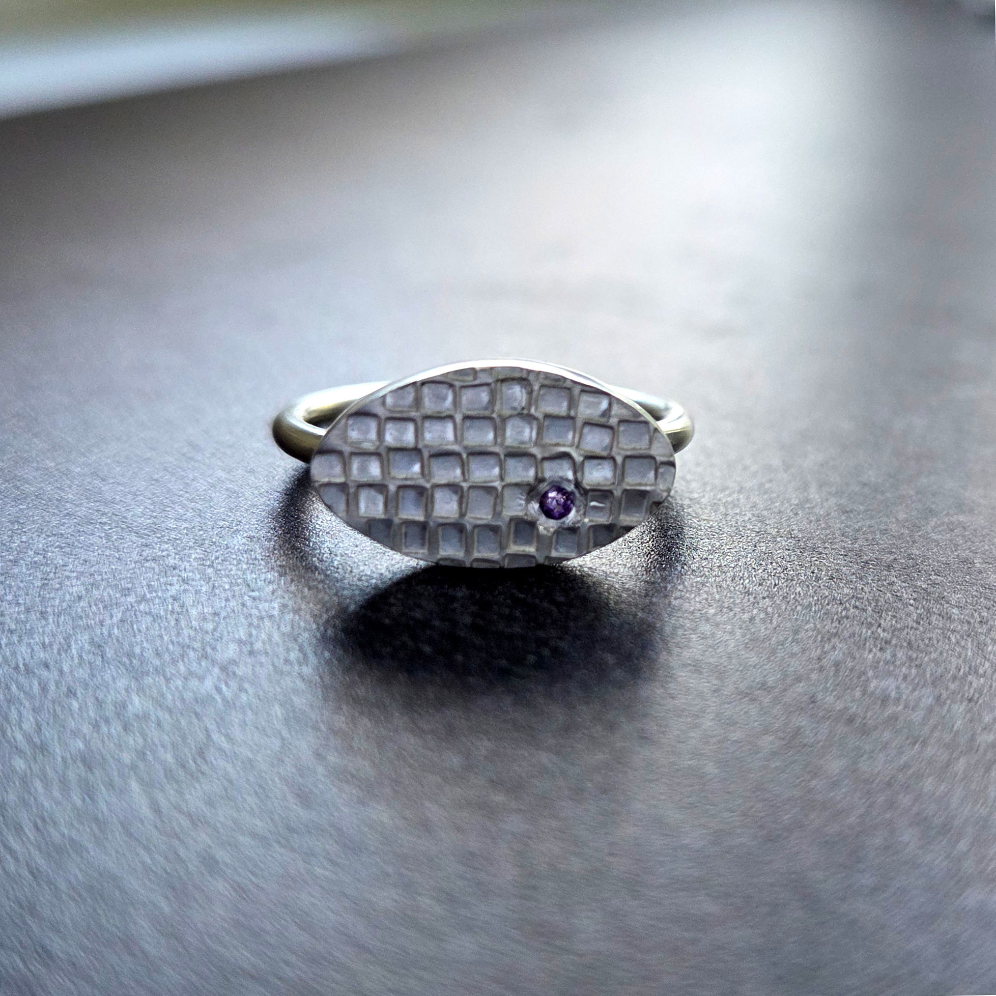 Oval handcrafted silver ring with tiny amethyst size O