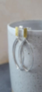 Handmade silver and gold earrings made by Nottingham jeweller Helen Shere