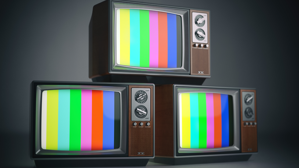 Eye-level view of a vibrant outdoor market with colorful stalls