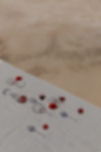 Wine glasses on a striped table, shadows. About the summer afternoon.