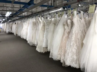 Rows of wedding gowns waiting to be preserved