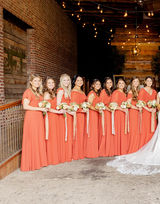 9 bridesmaids in orange dresses