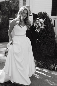 bride and groom in black and white walking