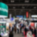a busy tradeshow with exhibitors showcasing their products and services to attendees from