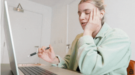 GIF of blonde woman in different office scenarios looking stressed.