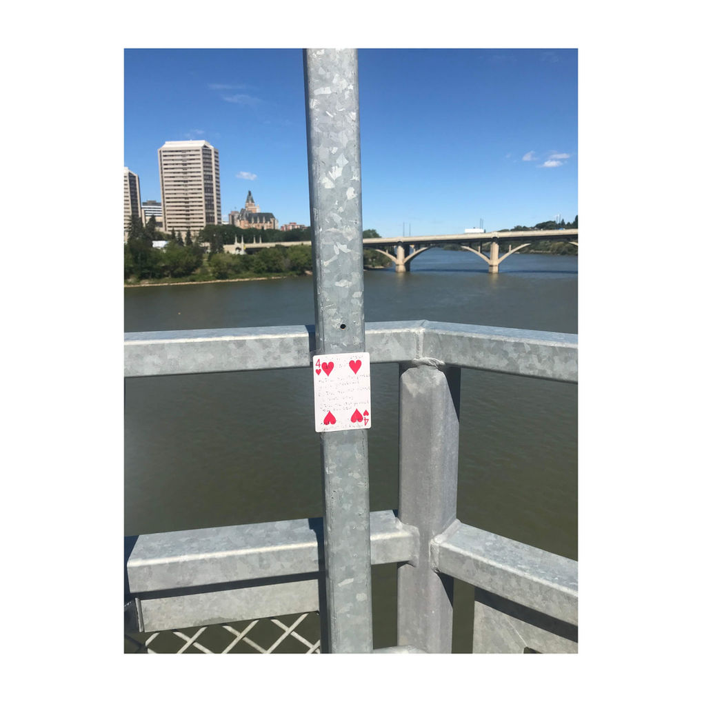 playing card on street trash litter garbage conceptual art lost card treasure hunt art