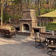 Outdoor Living Room with stone fireplace and paver patio