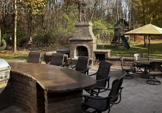 Outdoor Kitchen with Grill and Fireplace