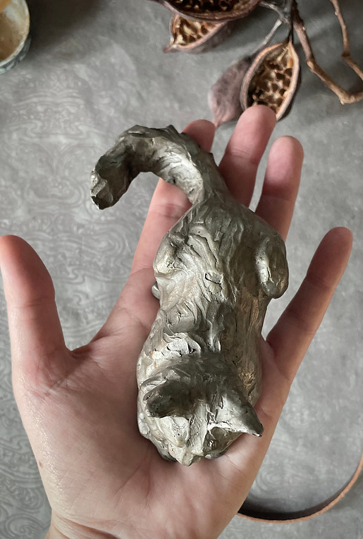 Feline Fancy bronze sculpture New branded image by Kindrie Grove in hand