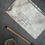 Thumbnail: Stride of Purpose, horse drawing by Kindrie Grove back of drawing flat lay with brush