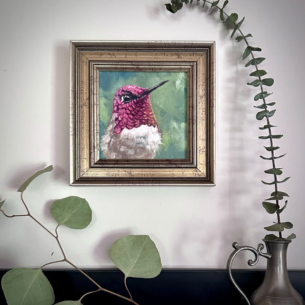 Anna's Hummingbird oil painting by Kindrie Grove, framed and hung on a wall