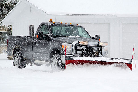 homeguide-residential-snow-plow-truck-clearing-driveway.jpg