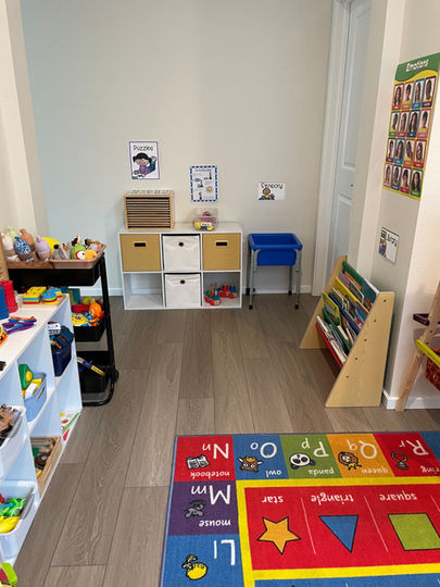 A cozy in-home daycare setting with colorful toys, children playing, and a caregiver supervising activities.