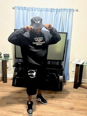 Owner in Custom Treasure Clothing posing