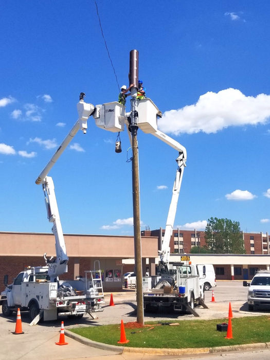 Crews work in Bucket trucks.