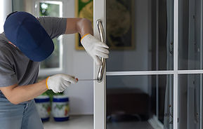 Worker install handle on aluminium swing door..jpg