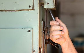 A male worker operating an industrial toggle switch..jpg