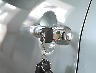 Key at car handle stock photo.jpg