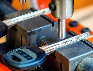 Key duplication machine (locksmith) stock photo.jpg