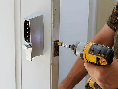 Man installing of the door lock security stock photo.jpg