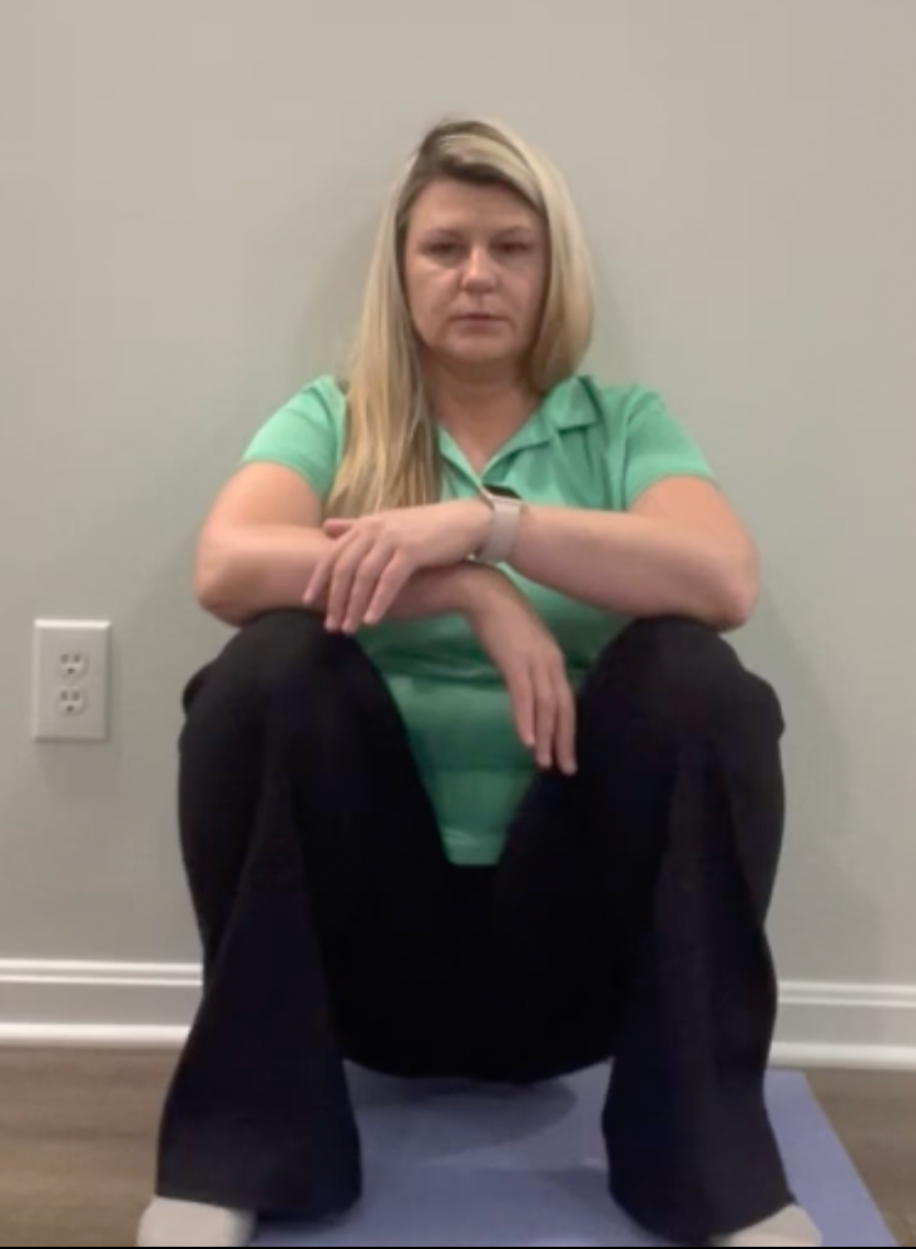 deep squatting with wall support