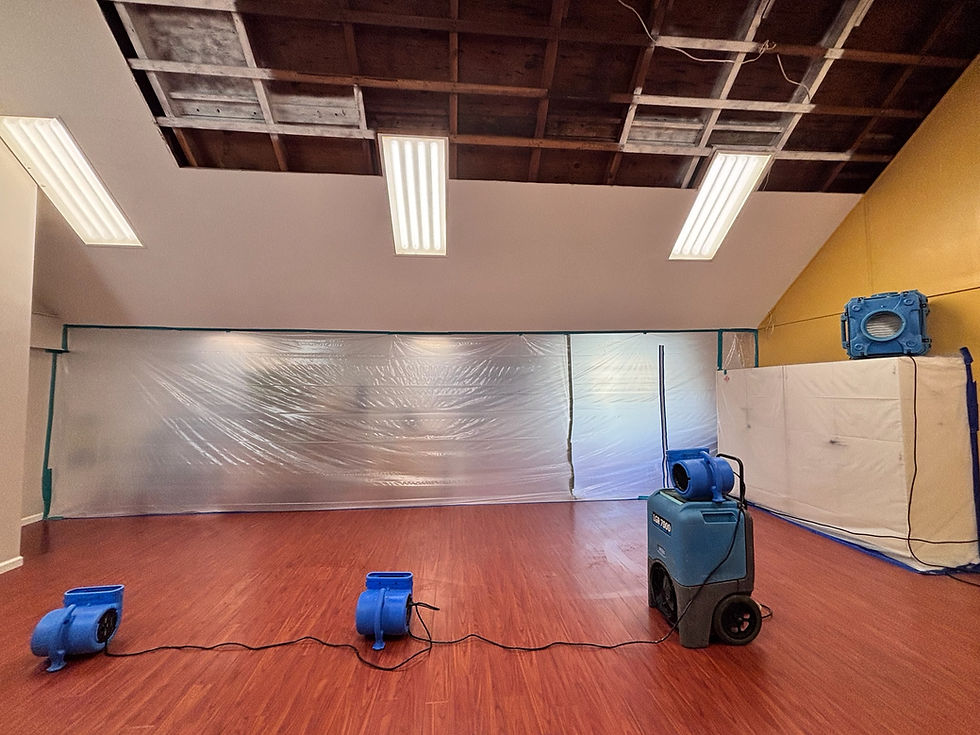 Drying equipment operating within containment to remove moisture and ensure safe restoration.