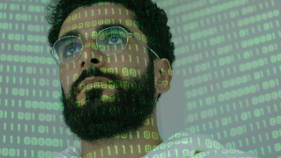 Close-up of a man with glasses and binary code projection, symbolizing cyber security.