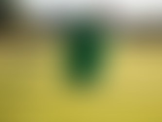 A close up wide angle shot captures a golfer mid swing on a sun drenched fairway The golfer is weari