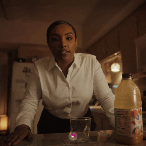 Young black woman in white shirt making a Instagram Reel