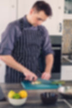 Chef chopping some green onions