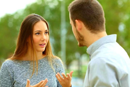 couple-talking-outdoors-park-green-background-relationship-communication-ss.jpg