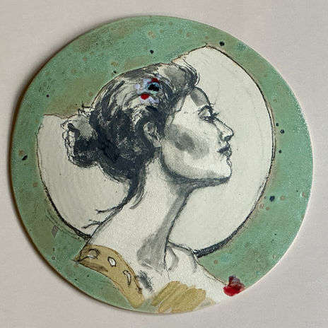 An original drawing on a ceramic shield of a woman for the wall by Nancy Hoopman