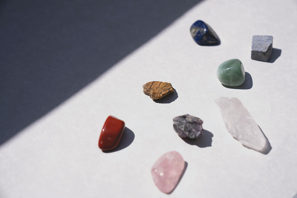 Collection of colourful crystals and gemstones paired together for energy healing, meditation, self-care, and spiritual rituals.
