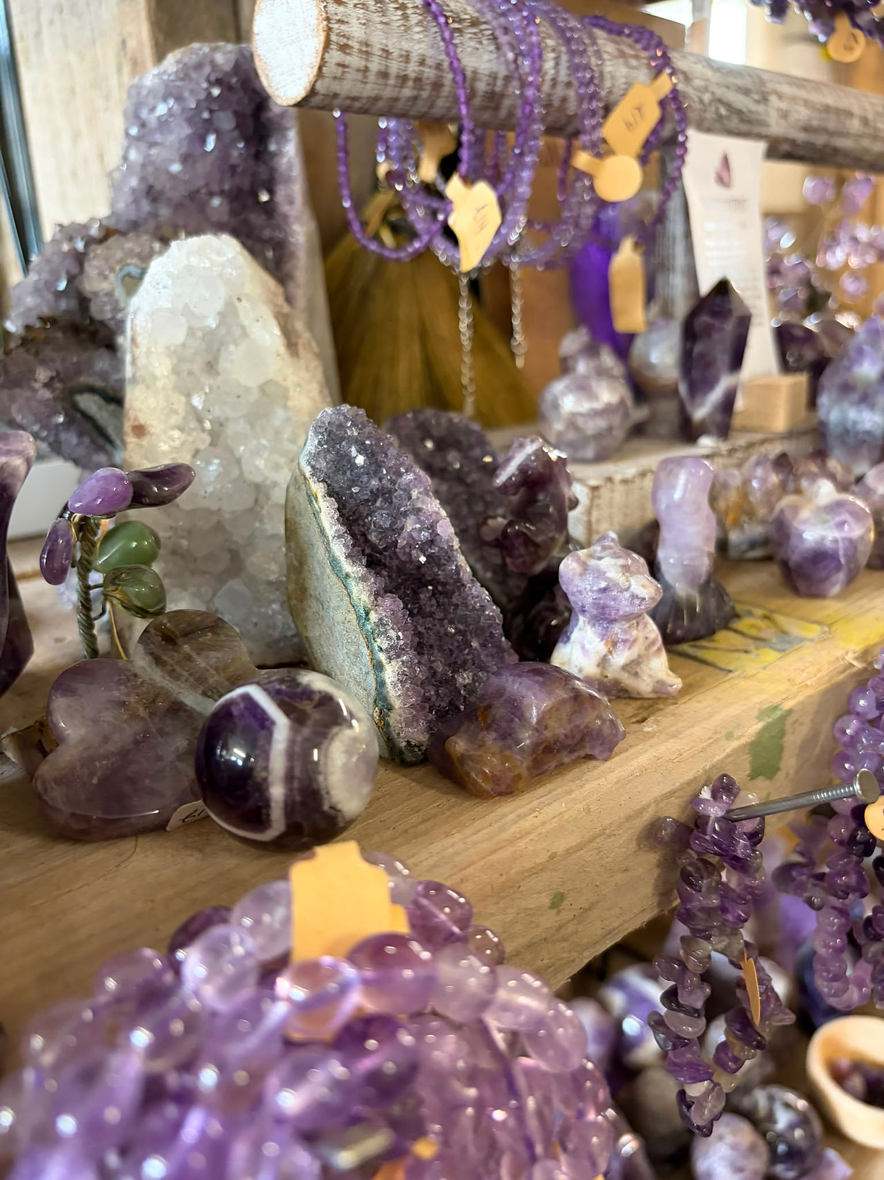 Beautiful purple Amethyst crystal cluster showcasing its natural colour and formations, representing peace, intuition and spiritual wisdom.