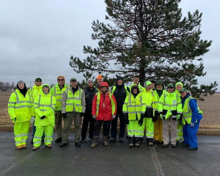 Volunteers in high-visibility jackets