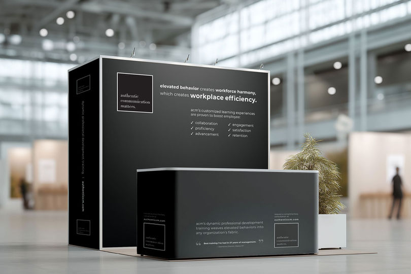 Image of a pop-up display and table cover at a business conference
