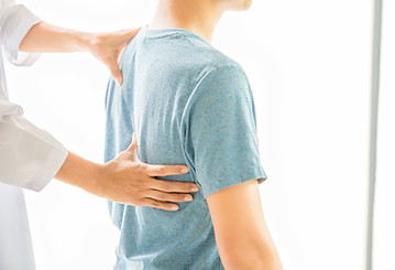 close-up-physiotherapist-working-with-patient-clinic.jpg