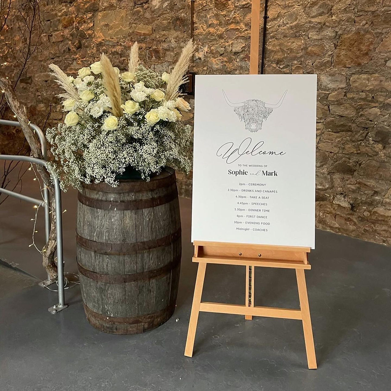 bespoke highland cow invitation featuring a venue graphic