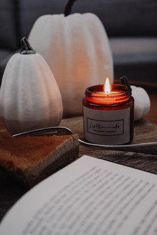 Fall candles with book and white pumkins