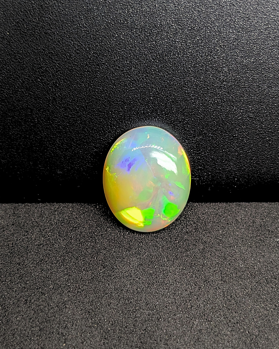 Thumbnail: Ethiopian Welo Opal 9 Ct oval cabochon with bright yellow fire