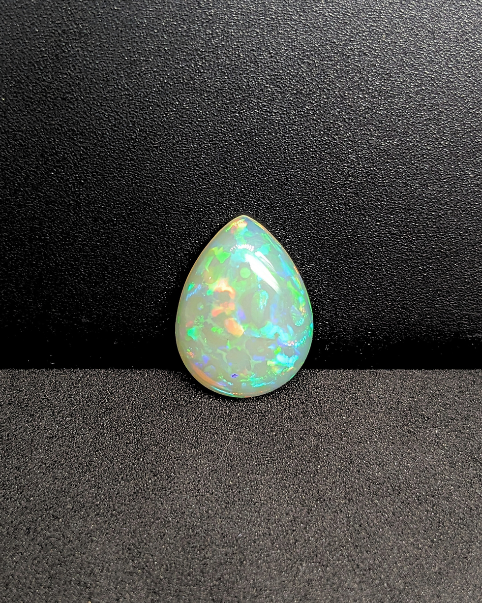 Thumbnail: Ethiopian Welo Opal 7 Ct pear cabochon with green fire