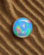 Round cabochon opal with fire