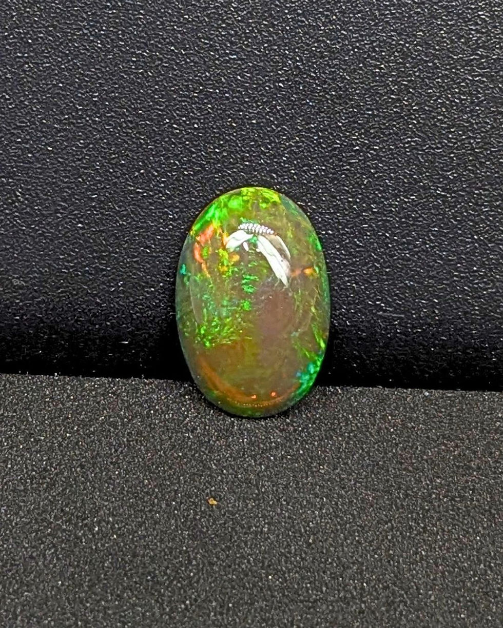 Thumbnail: Untreated Ethiopian opal with visible color flashes under light.