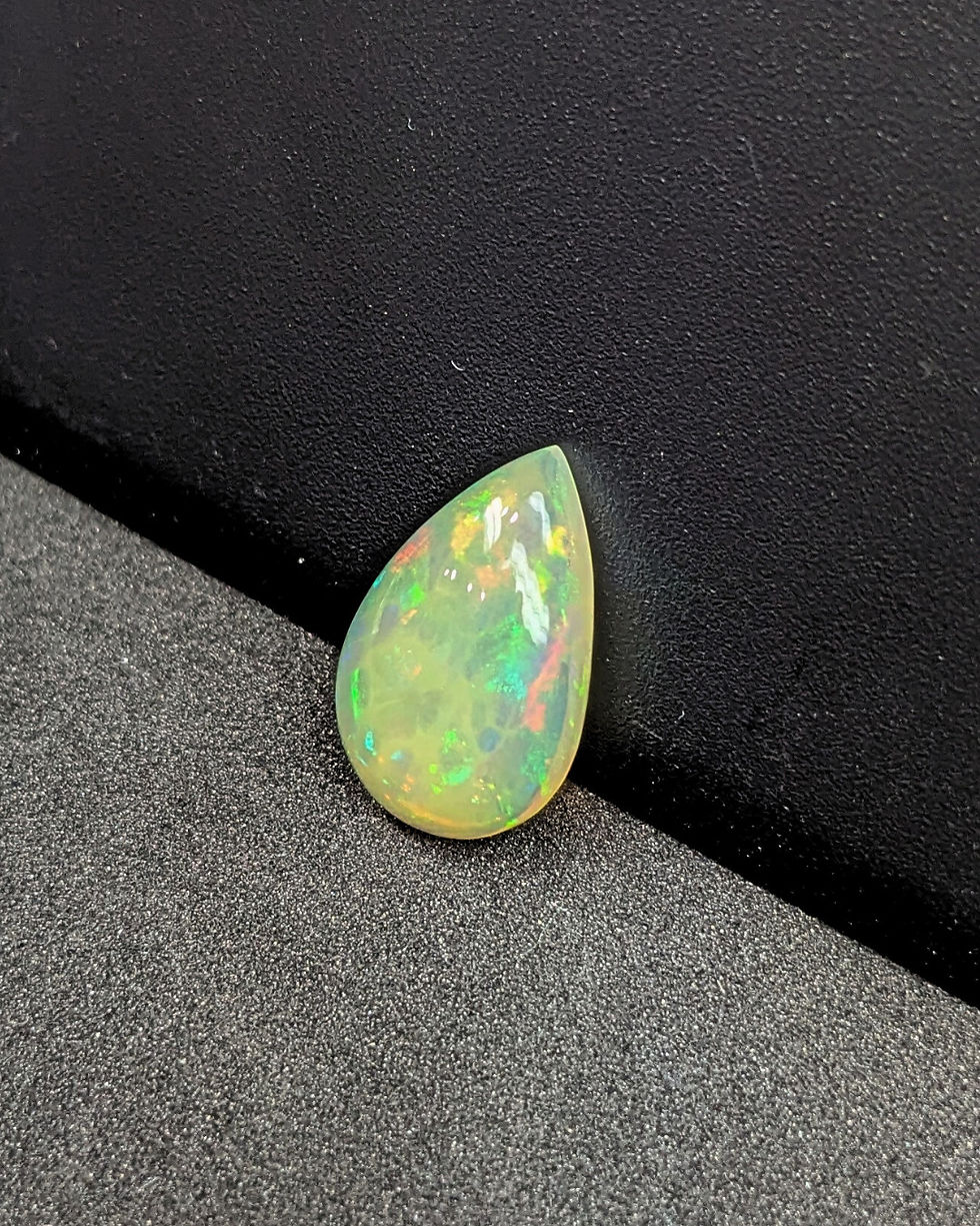 Thumbnail: Smooth polished yellow Ethiopian opal pear cabochon