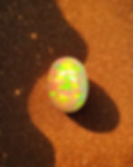Natural yellow Ethiopian Welo opal 5 carat oval cabochon