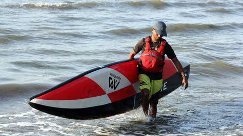 Kumaran with his paddleboard at Palk Bay Center, Tamilnadu