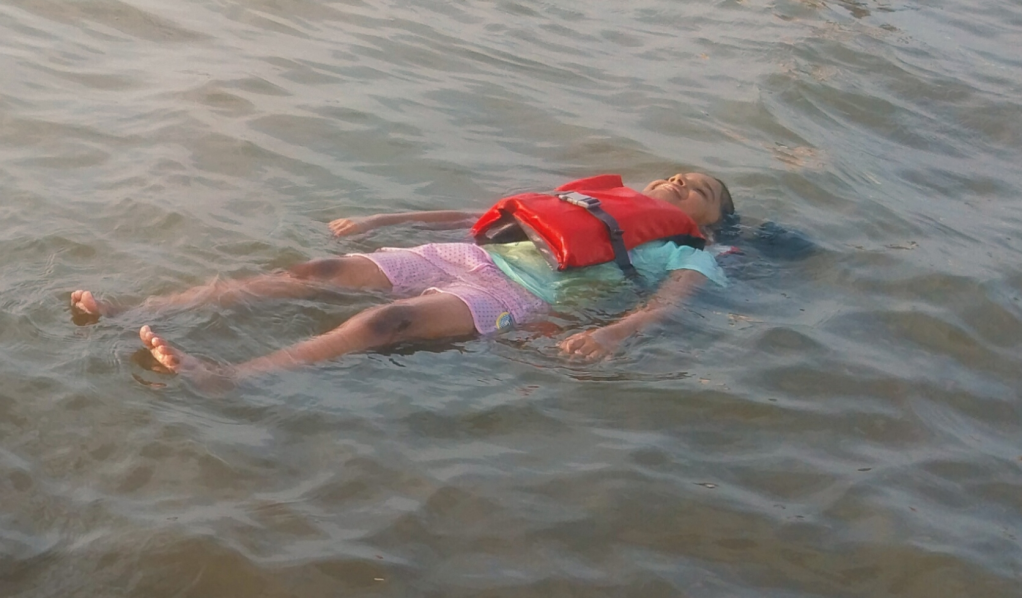 Kid enjoying her floatation - Mangrovebay Ecocamp - River Kollidam Standup Paddle Expeditions India