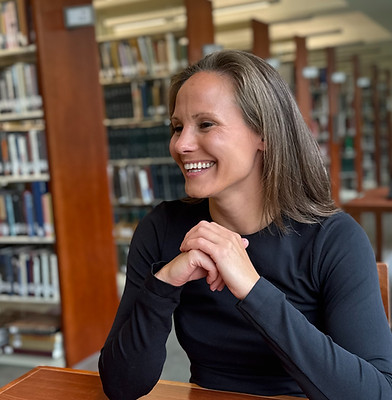 Tutor smiling at library