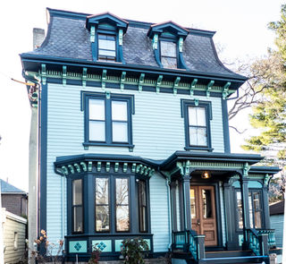 OG-5 historic gutter replacement on teal painted Victorian home